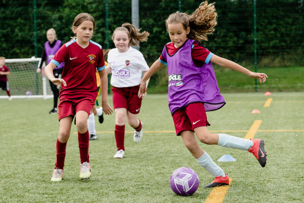 Wales Womens national team manger, Gemma Grainger & Wales senior Womens player Rachel Rowe take part in a Evans & Williams AFC huddle session at Coleg Sir, Llanelli, Wales