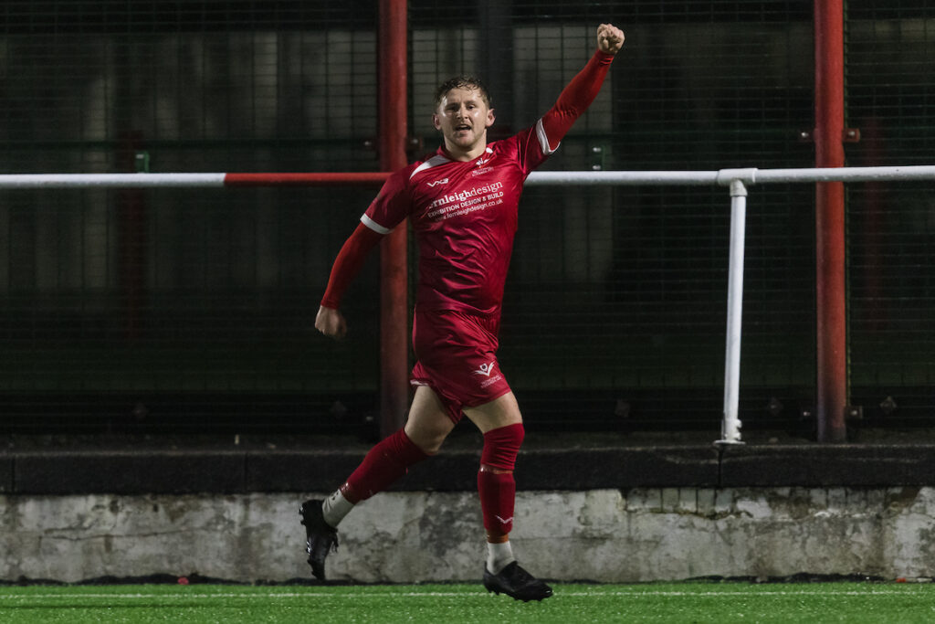 Trethomas' Levi Rees scores and celebrates during the 2022/23 FAW Amateur Trophy Semi Final fixture between Llandrindod Wellls FC & Trethomas Bluebirds AFC at The Bont Stadium, Merthyr Tydfil, Wales, 17th March 2023