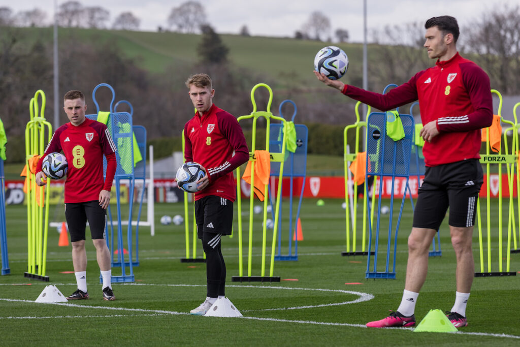 Wales' Joe Morrell, Ollie Cooper and Kieffer Moore during a training session at the vale resort.