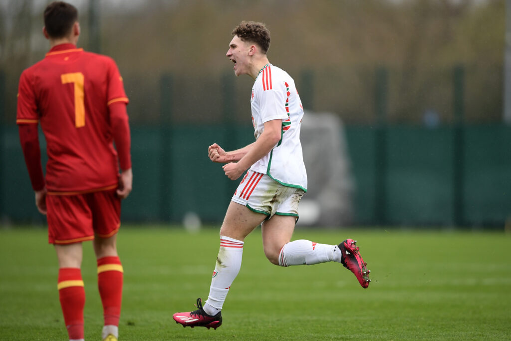 Iwan Morgan of Wales celebrates scoring his side's first goal during the UEFA U17 Championship Qualification fixture between Wales and Montenegro at Dragon Park, Newport, Wales