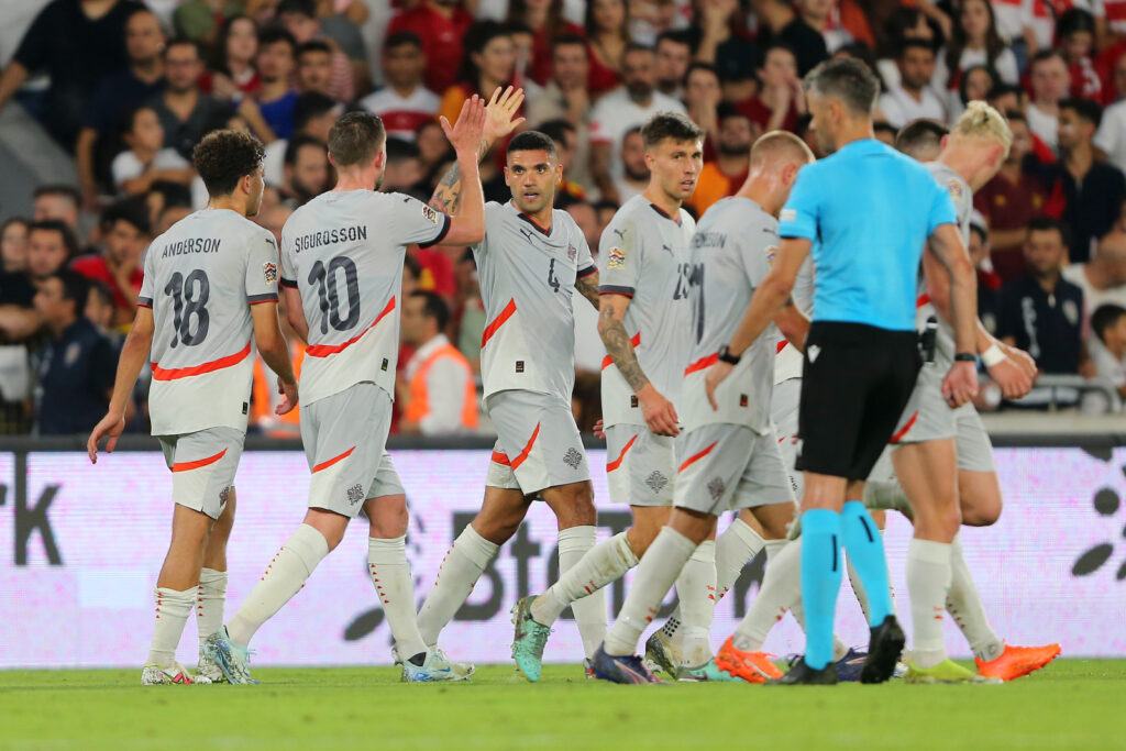 Victor Palsson of Iceland celebrates scoring his team's first goal with Gylfi Sigurdsson and team mates during the UEFA Nations League 2024/25 League B Group B4 match between Türkiye and Iceland at Gursel Aksel on 9 September