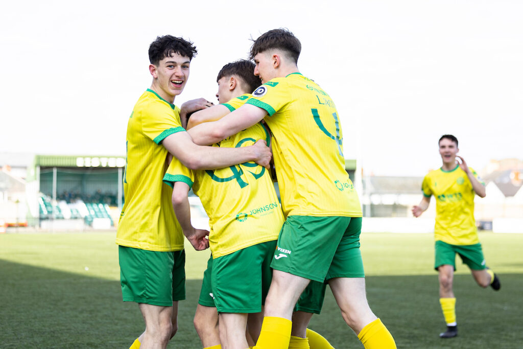 Caernarfon Town players celebrate with during the 2024/25 Welsh Youth Cup Semi Final fixture between Caernarfon Town and Newport County at Park Avenue, Aberystwyth, Wales