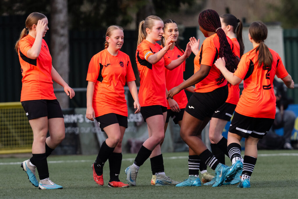 Pontypridd's Eliza Keane scores and celebrates 0-3 during the 2024/245 Bute Energy U16s Cup Semi Final fixture between The New Saints Girls U16s and Pontypridd United Girls U16s at Latham Park, Newtown, Wales.