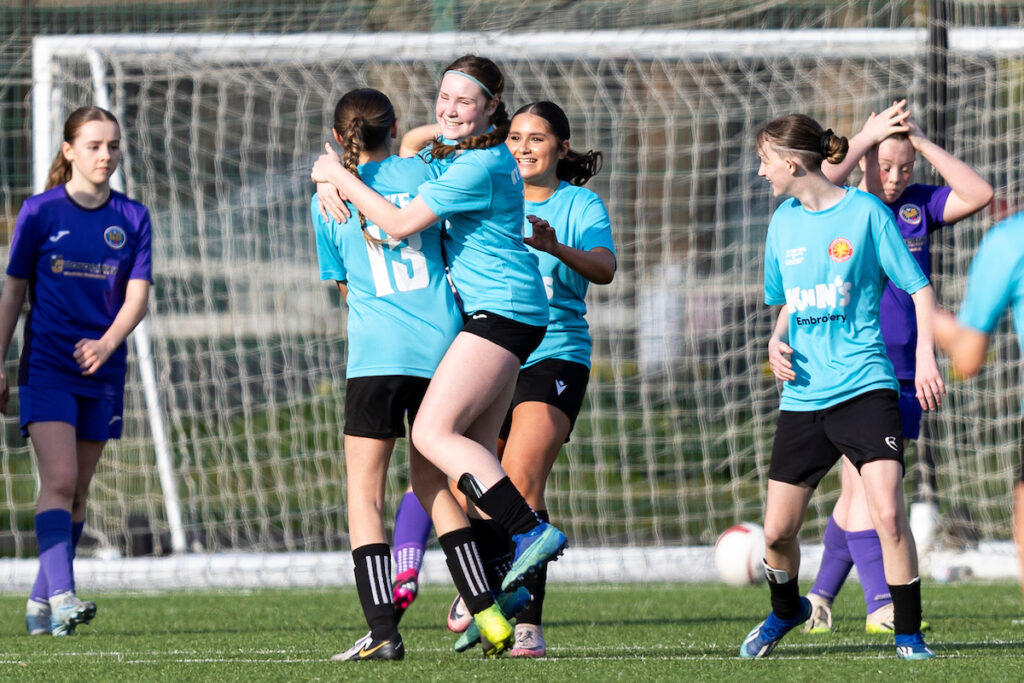 Aimee Cake of Cardiff Wanderers celebrates scoring her sides third goal against Porth Harlequins in the Bute Energy U16s Cup semi-final