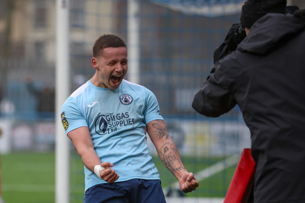 Calum Bateman of Cambrian United FC celebrates after scoring during the 2024/25 FAW Welsh Cup Quarter Final fixture between Cambrian United FC and Carmarthen Town AFC  at M&P Group 3G, Tonypandy, Wales