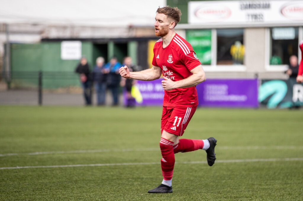 Connah's Quay Nomads' Callum Bratley puts The Nomads in front during the JD Welsh Cup Semi Final between Connah’s Quay Nomads and Llanelli Town at Park Avenue, Aberystwyth. 15th of March, Aberystwyth, Wales