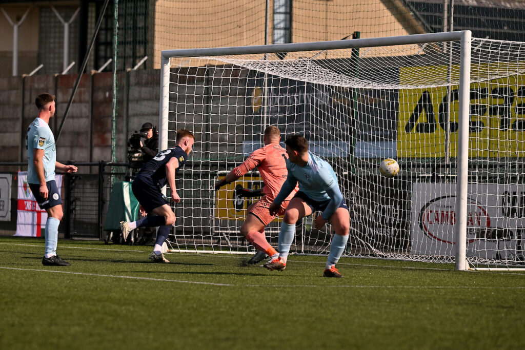 Zack Clarke of The New Saints F.C. scores his sides third goal in the FAW Welsh Cup Semi Final Match between Cambrian United and The New Saints at Park Avenue in Aberystwyth, Wales