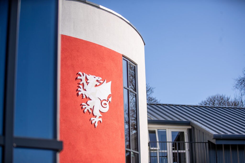 The Football Association of Wales Dragon emblem on Colliers Park in Wrexham. FAW reports further growth and investment following release of accounts.