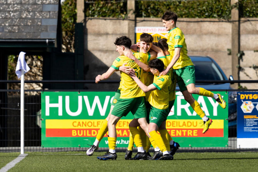 Harri Lambe celebrates scoring for Caernarfon Town against Newport County in the semi-final of the FAW Youth Cup