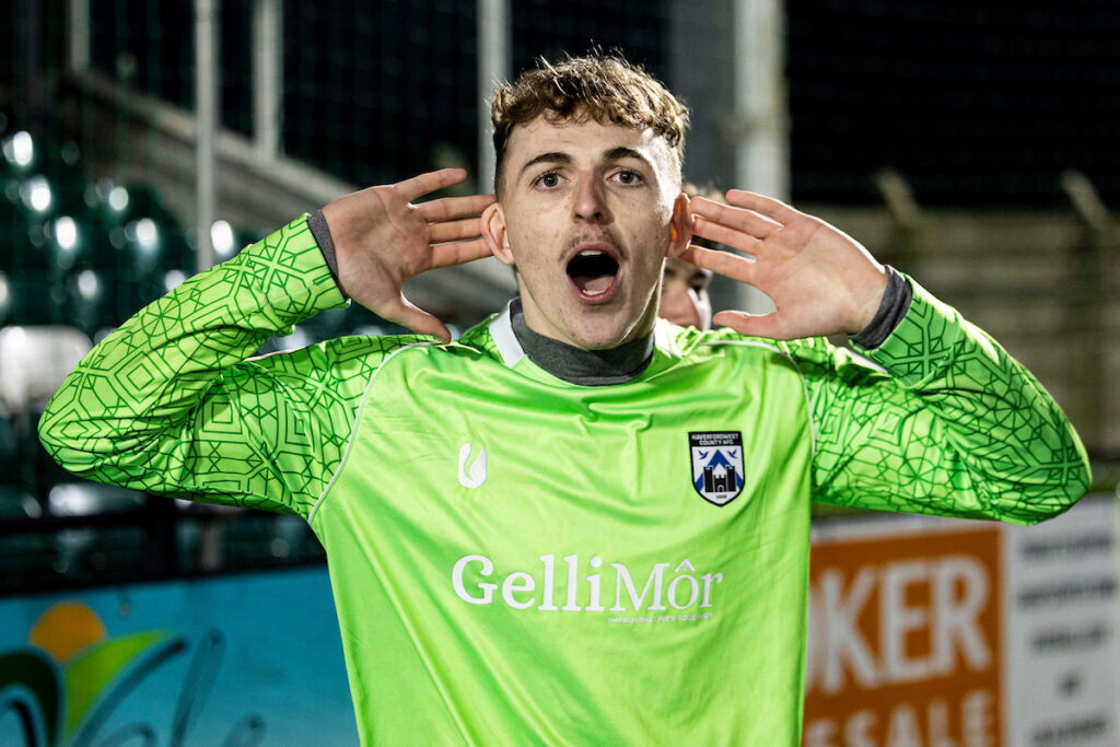 Corey Mathias celebrates after Haverfordwest County beat Newtown in the semi-final of the FAW Youth Cup
