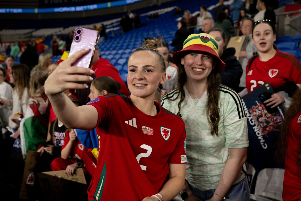 Lily Woodham with fans during the UEFA Women's Nations League A Match between Wales and Denmark at The Cardiff City Stadium in Cardiff on the 4th April 2025