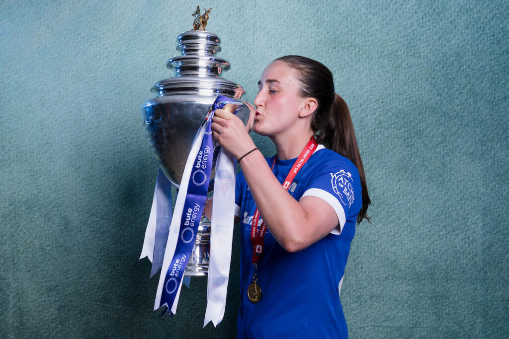 Cardiff City Womens' Amy Long poses with trophy after the 2024/25 Bute Energy Welsh Cup Final fixture between Wrexham AFC Women & Cardiff City Women FC at Rodney Parade, Newport, Wales