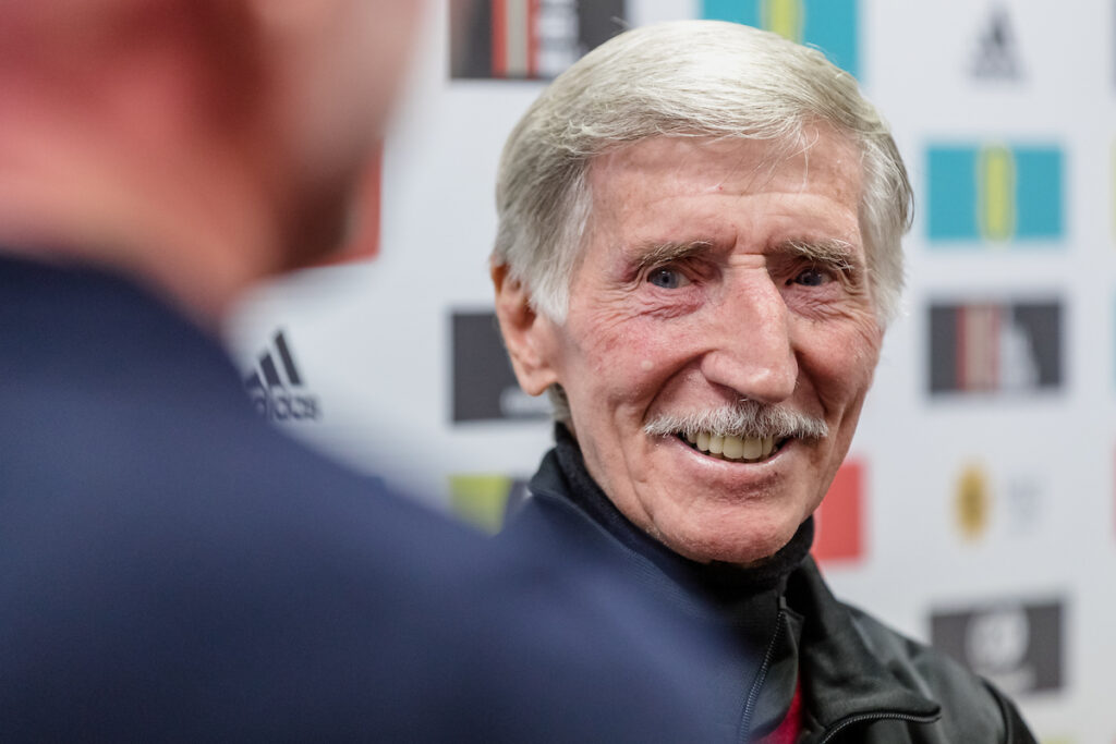 Cymru/Wales Head Coach Robert Page meets Spurs legend and ex Wales international and 1958 Wales World Cup player Cliff Jones during the Cymru squad announcement for the 2022 FIFA World Cup at Tylorstown Welfare Hall, Rhondda, Wales, 9th November