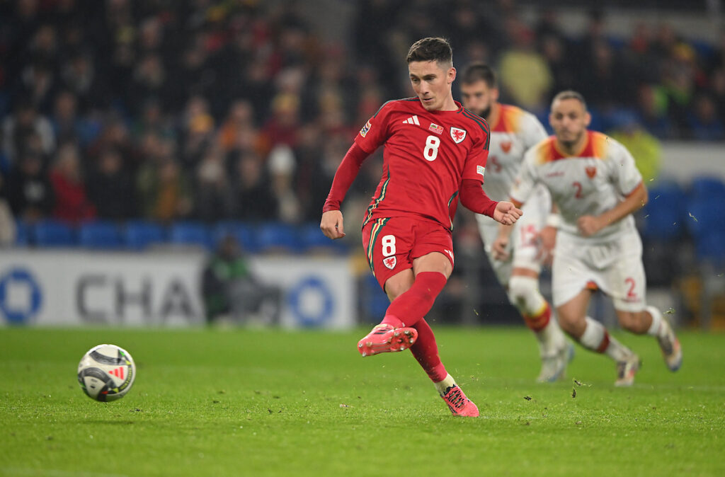 Harry Wilson in action for Wales during a Cymru match