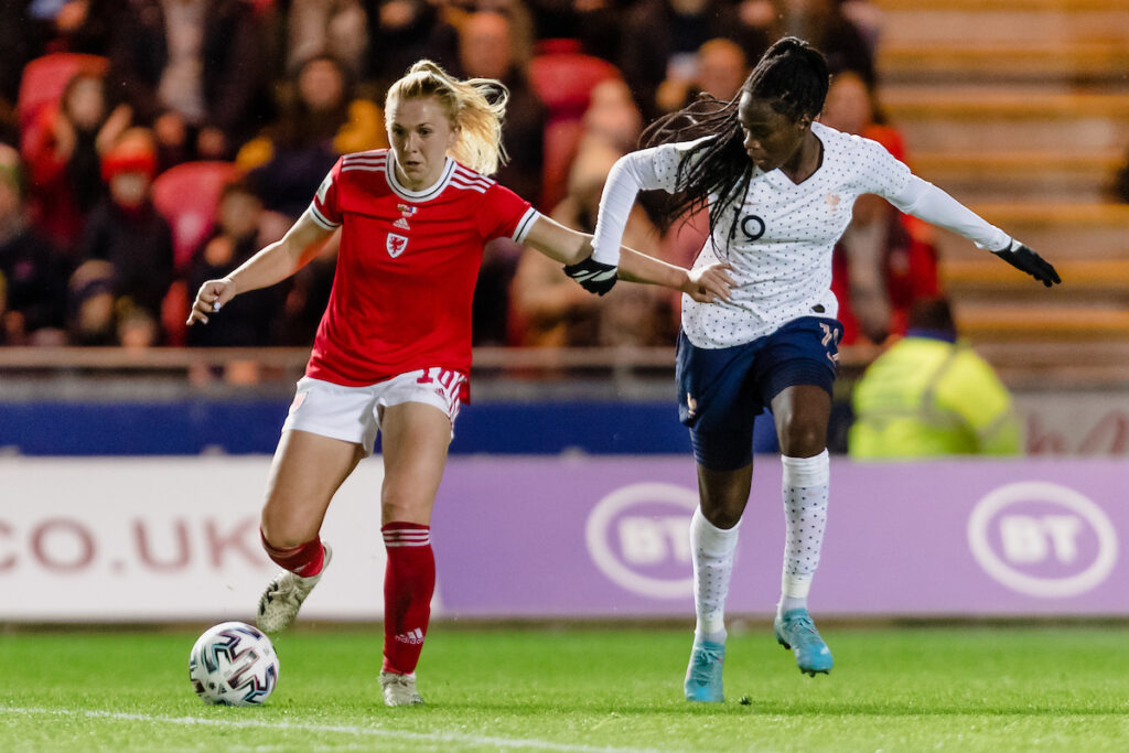 Ceri Holland of Cymru in action against France during a match in 2022