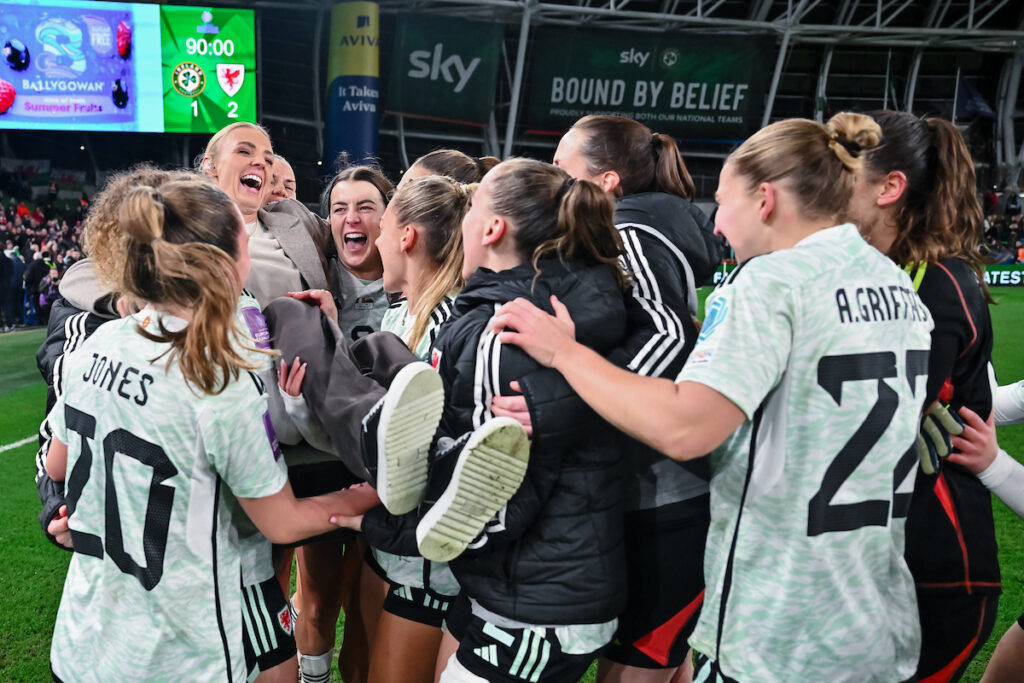 Sophie Ingle lifted by her teammates after Cymru qualify for the EURO 2025 against the Republic of Ireland