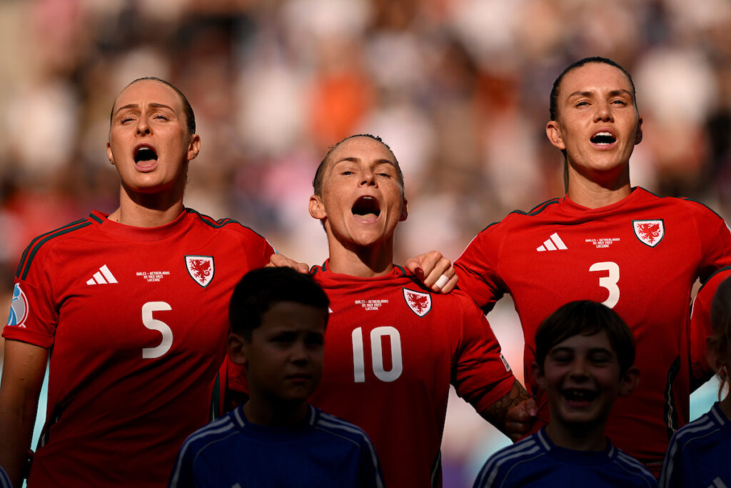 Wales’ Jessica Fishlock, Gemma Evans and Lily Woodham sing the national anthem ahead of the UEFA Women’s Euro 2025 Group D Match between Wales and Netherlands at Allmend Stadion Luzern, in Switzerland on the 5th July 2025