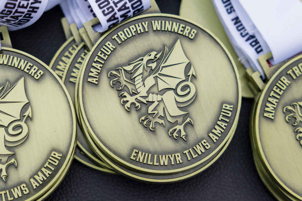 A detailed view of the Dragon Signs Amateur Trophy medals