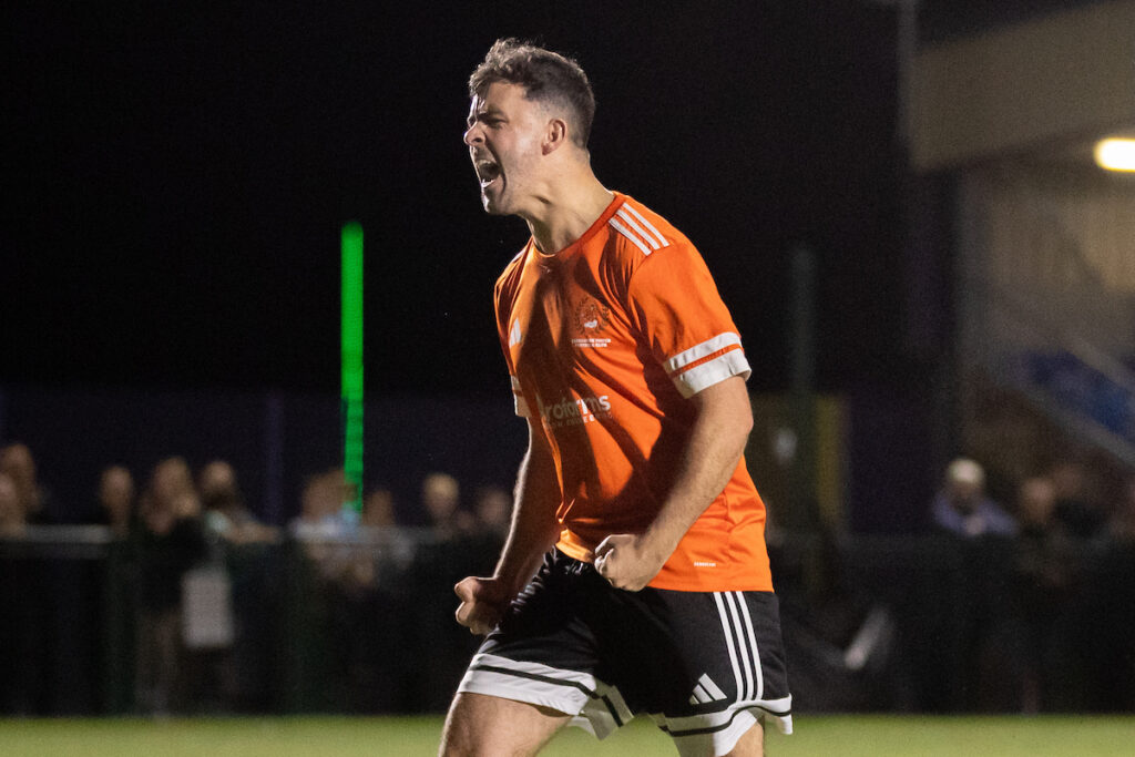 Broughton United's Jake Jones celebrates his winning penalty following the JD Welsh Cup fixture between Broughton United and Welshpool Town at the Hollingsworth Bros Stadium, Broughton, 19th of September, Wales