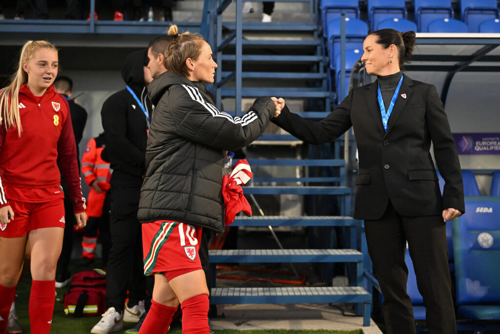 Cymru's Jess Fishlock and Wales Women's National Team Manager Rhian Wilkinson during the UEFA Women's Euro 2025 Play Off Semi Final First Leg Match at The National Training Centre Poprad Stadium in Proprad on the 25th October 2024