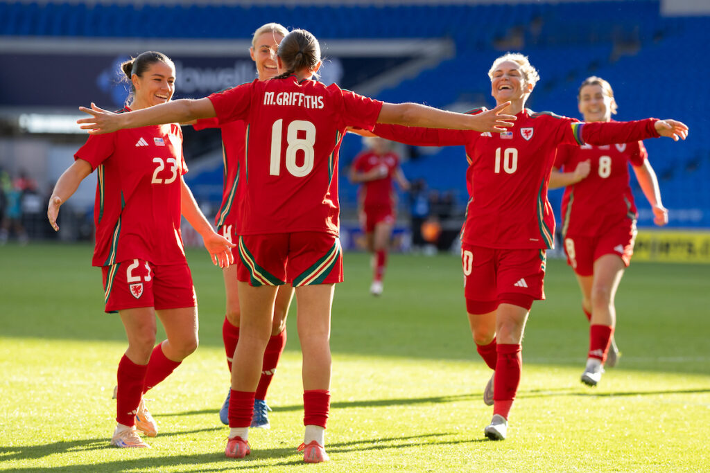 Mared Griffiths celebrates scoring Wales' equaliser against Australia as Jess Fishlock runs to her to celebrate.