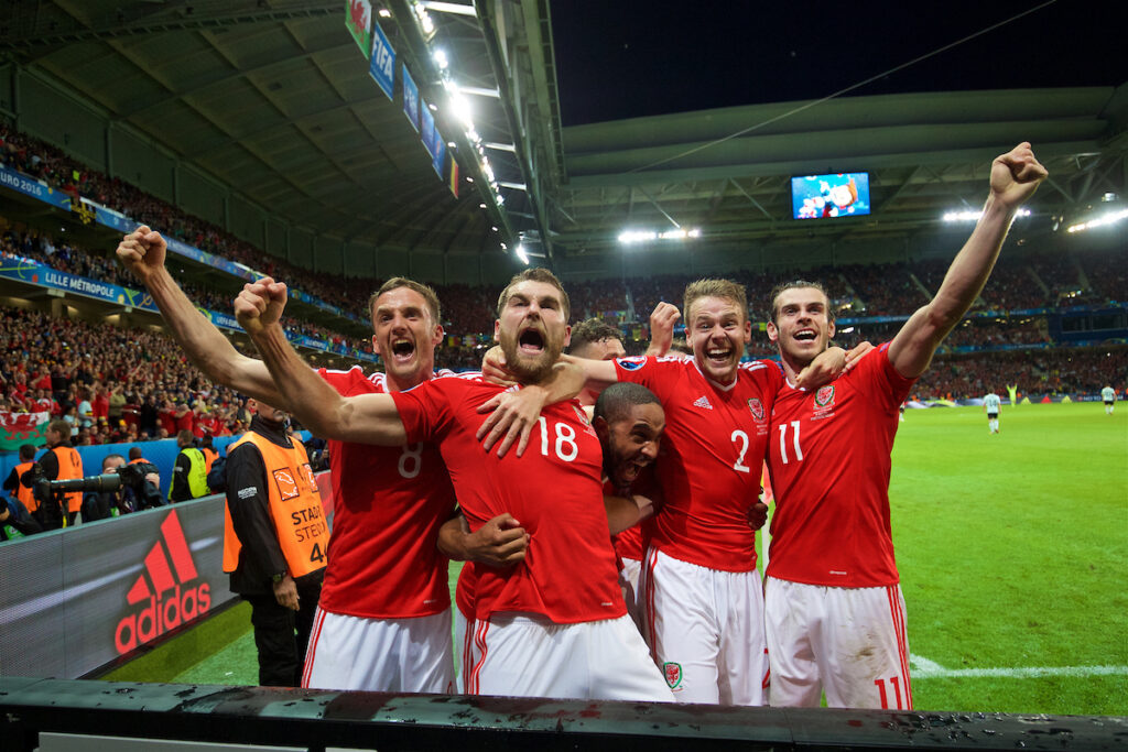 Andy King, Sam Vokes, Ashley Williams, Chris Gunter and Gareth Bale celebrate Cymru's third goal against Belgium in the UEFA EURO 2016 Quarter-Finals.