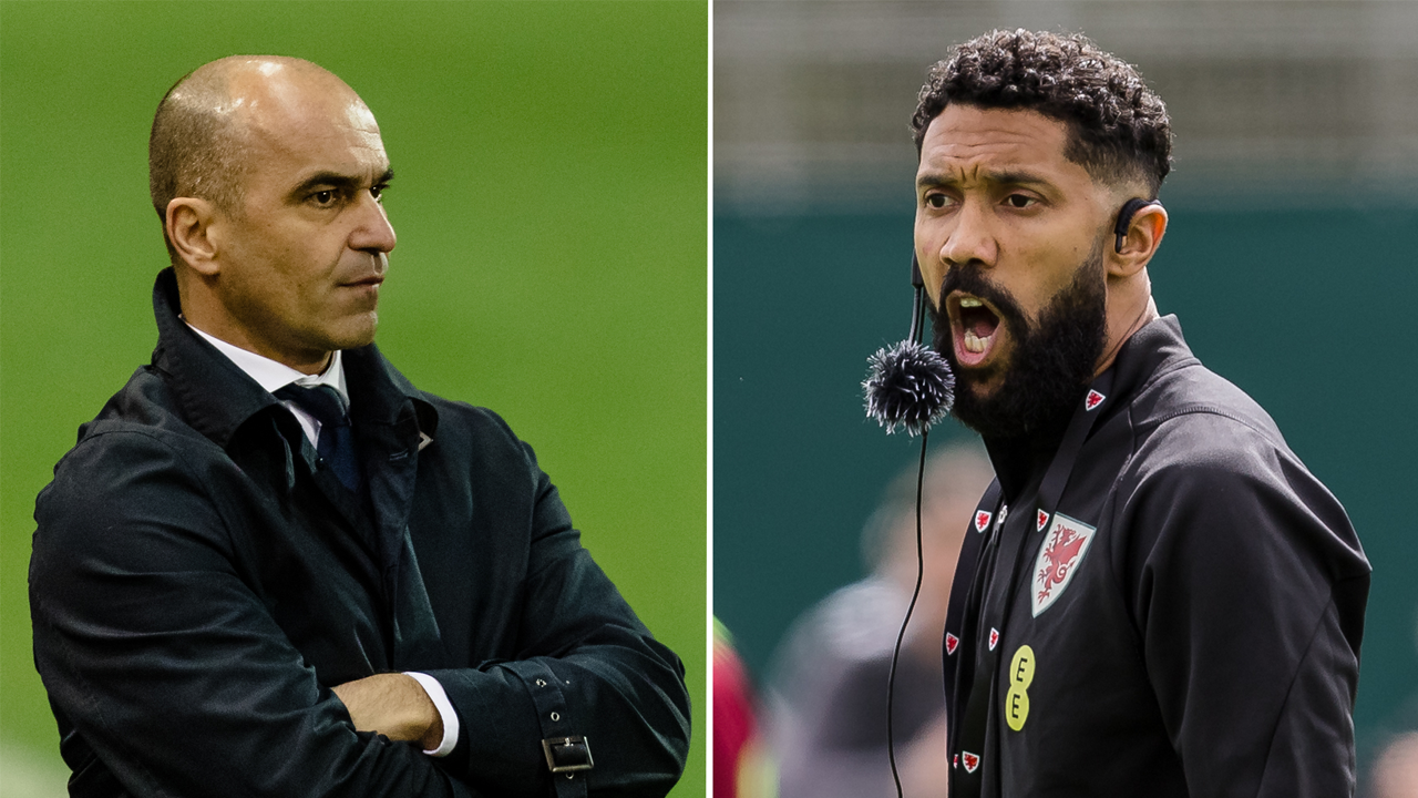Portugal manager Roberto Martinez (L) with his arms folded and Gael Glichy (R) conducting a Coaching Session